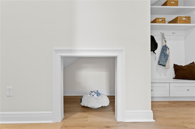 mudroom with light hardwood / wood-style flooring