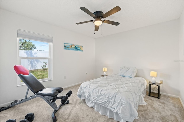 carpeted bedroom featuring ceiling fan