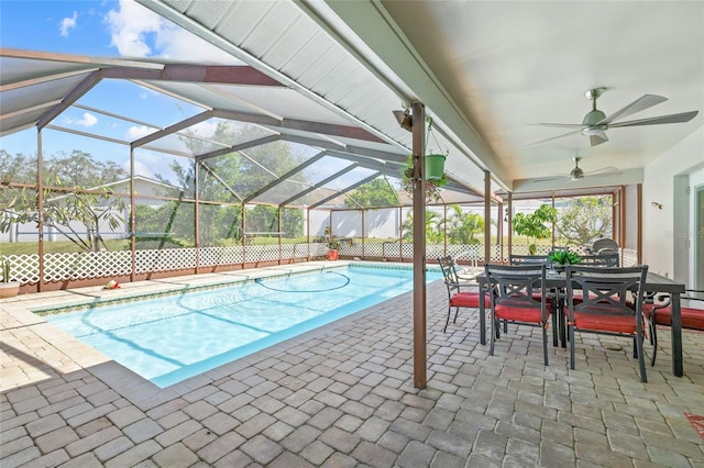 view of swimming pool with a lanai, a patio area, and ceiling fan