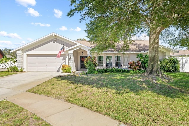 single story home featuring a garage and a front yard