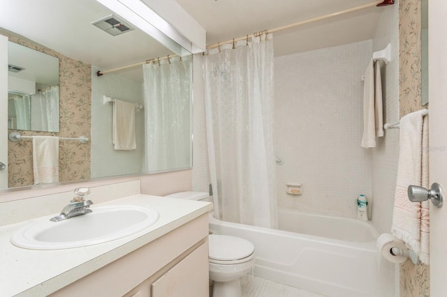 full bathroom featuring vanity, toilet, and shower / bath combination with curtain