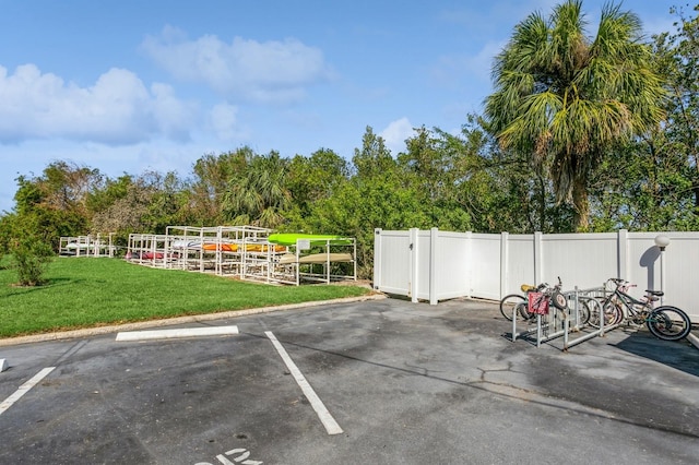 view of car parking with a yard