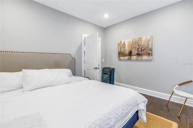 bedroom featuring dark wood-type flooring