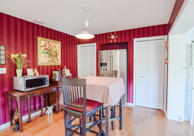 dining room with light hardwood / wood-style floors