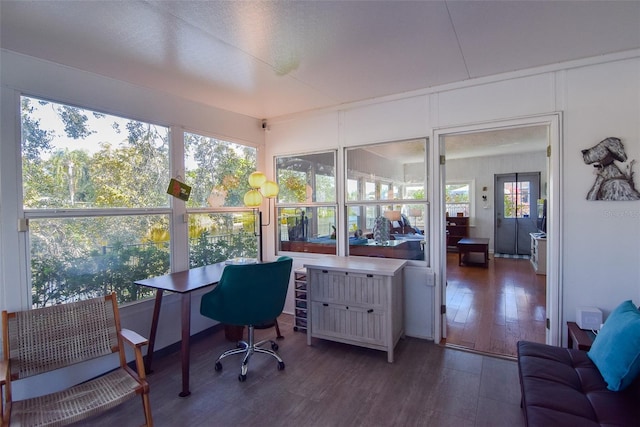 home office featuring dark hardwood / wood-style flooring and plenty of natural light