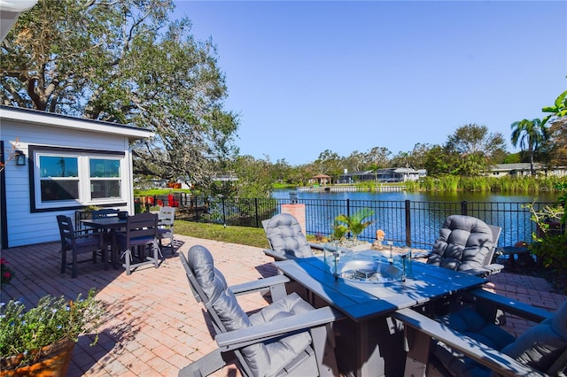 view of patio featuring a water view