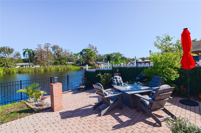 view of patio featuring a water view