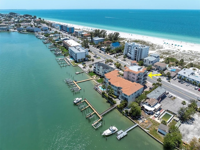 aerial view with a water view and a beach view