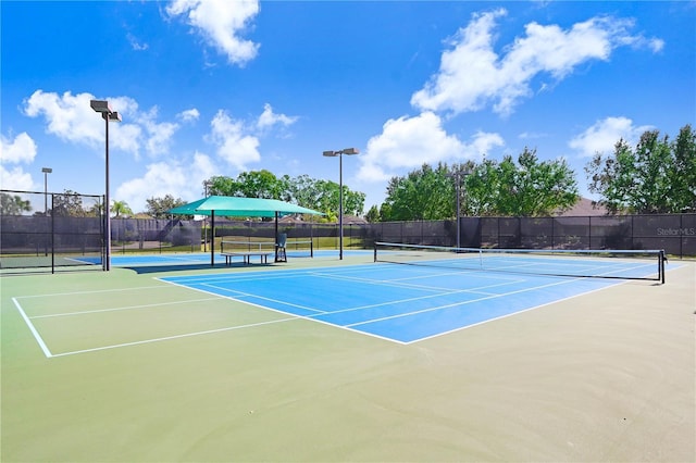 251 Tomelloso Way, Davenport, FL 33837 - view of tennis court with community basketball court and fence
