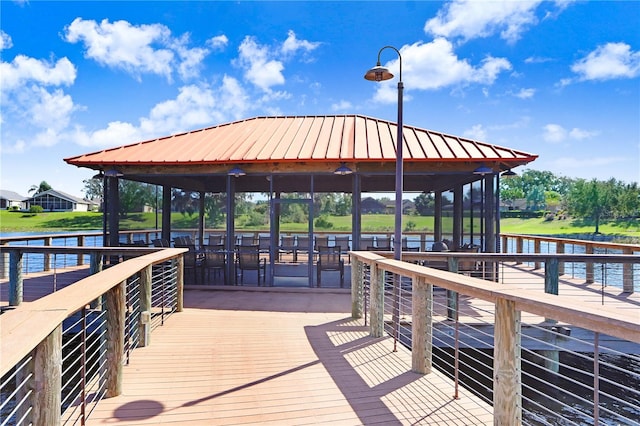 view of dock with a water view and a gazebo