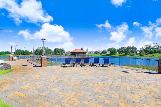 view of swimming pool with a water view