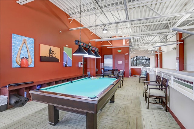 game room featuring rail lighting and light parquet floors