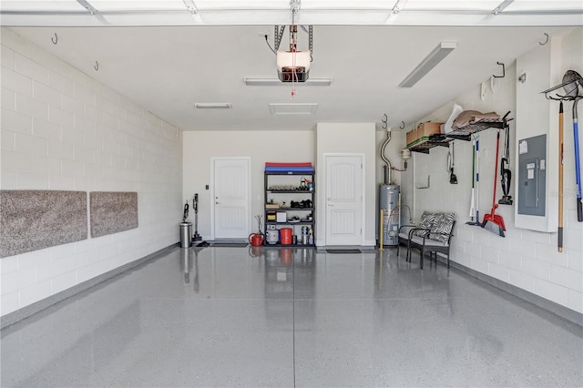 garage with gas water heater and electric panel