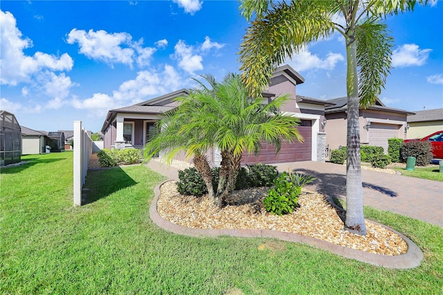 view of front facade featuring a garage and a front lawn