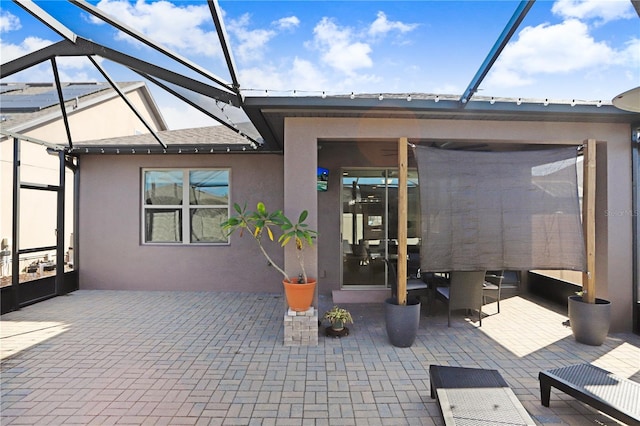 rear view of house featuring a patio area and a lanai