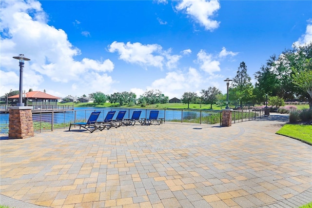 view of pool with a water view