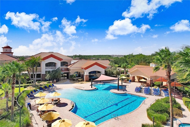 view of swimming pool with a gazebo and a patio area