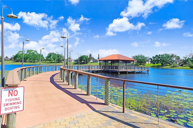 view of dock featuring a water view and a gazebo