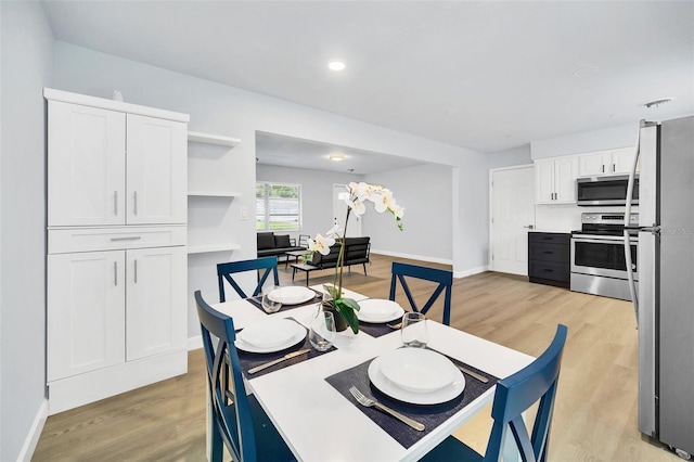 dining space featuring light hardwood / wood-style floors