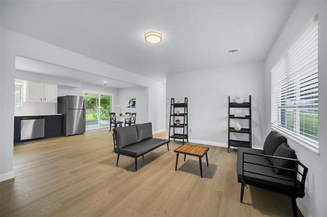 sitting room featuring light hardwood / wood-style floors