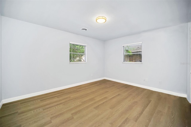 spare room featuring hardwood / wood-style flooring