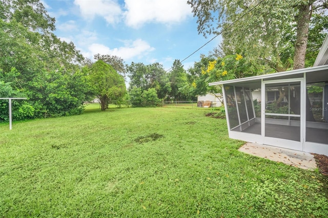 view of yard with a sunroom