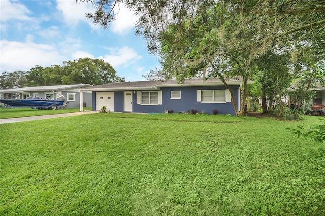 single story home featuring a front yard and a garage