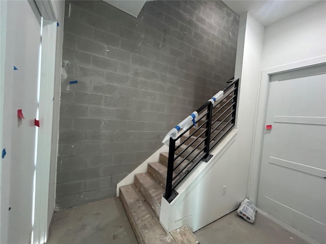 stairs with concrete floors