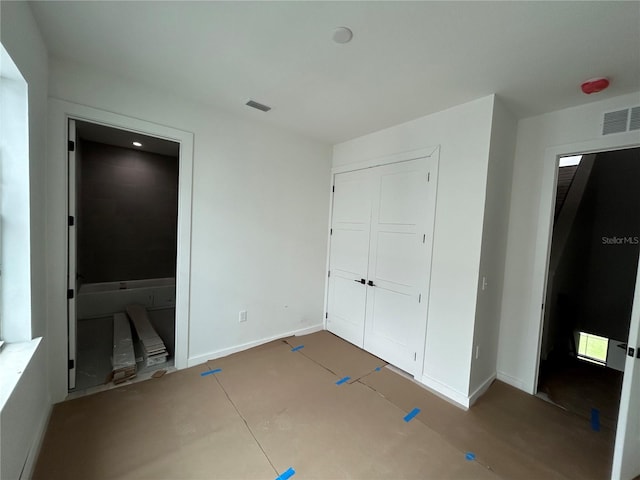 unfurnished bedroom with a closet