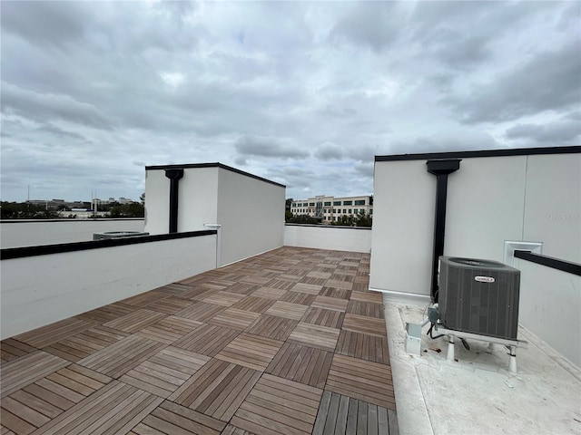 view of patio / terrace featuring central AC and a balcony