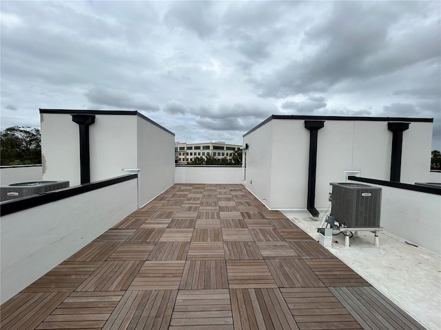 view of patio featuring a balcony and cooling unit