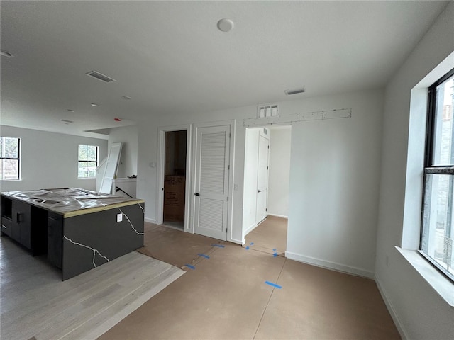 kitchen with a center island and a wealth of natural light