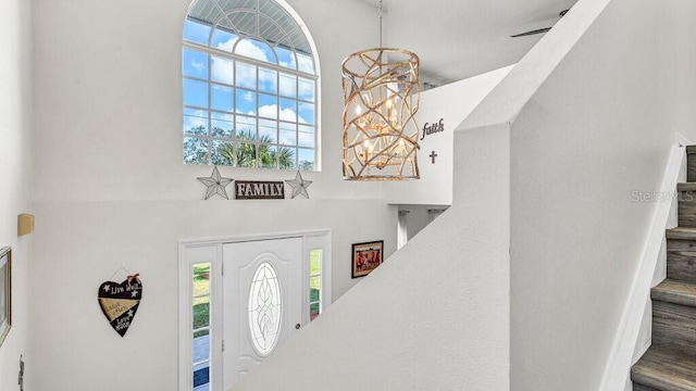 foyer featuring a notable chandelier and wood-type flooring