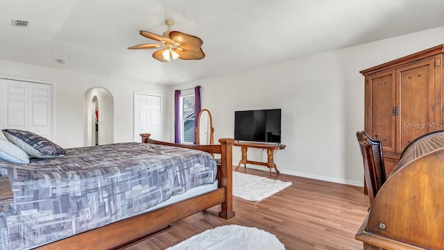 bedroom featuring ceiling fan and light hardwood / wood-style floors