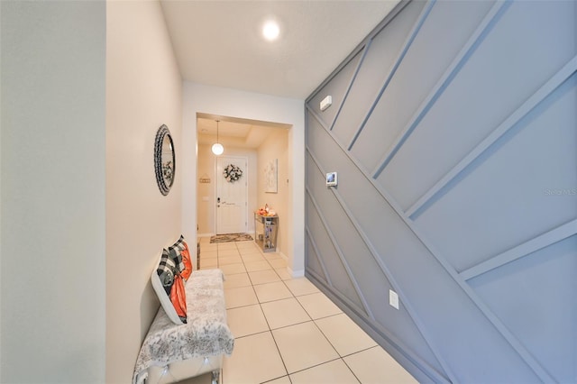 corridor featuring light tile patterned flooring