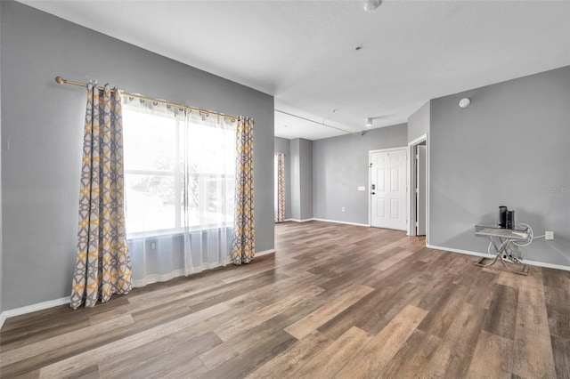 spare room featuring hardwood / wood-style flooring