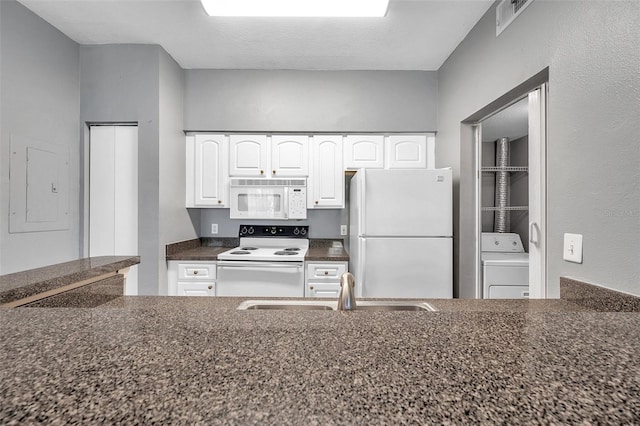 kitchen featuring white appliances, electric panel, white cabinets, sink, and washer / clothes dryer