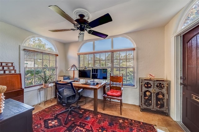 office area featuring tile patterned flooring and ceiling fan