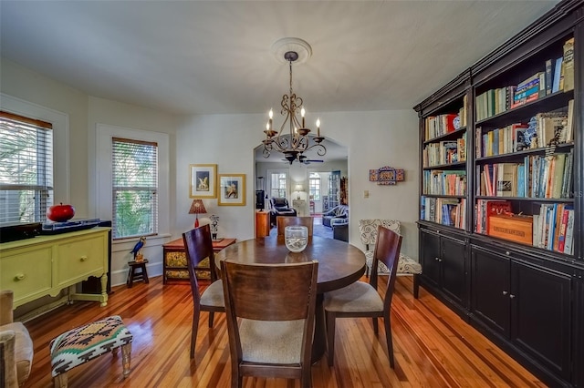 dining room featuring light hardwood / wood-style floors and a chandelier