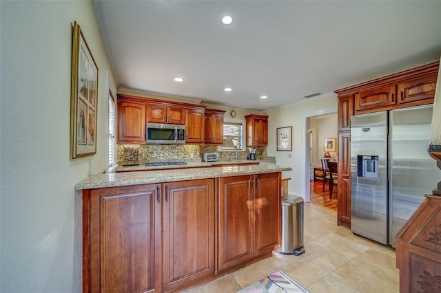 kitchen featuring light stone countertops, appliances with stainless steel finishes, backsplash, ornamental molding, and light tile patterned floors