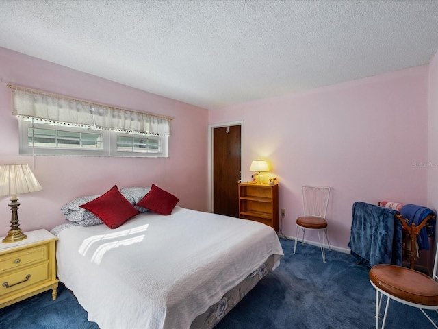 carpeted bedroom with a textured ceiling