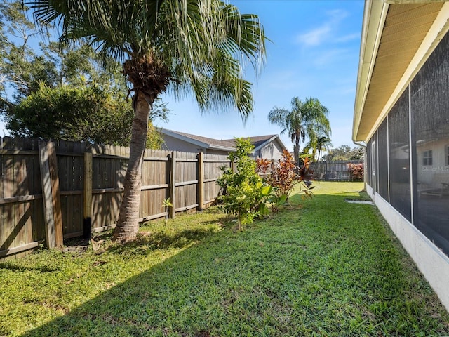 view of yard featuring a sunroom