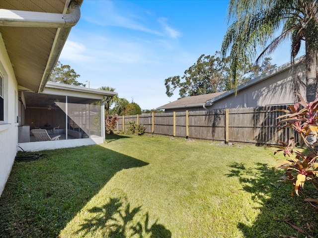 view of yard featuring a sunroom