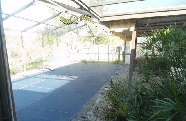 view of patio / terrace with glass enclosure