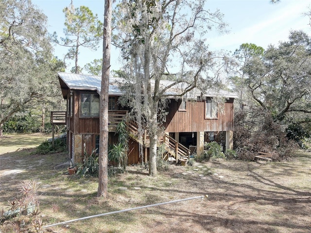 view of outbuilding with stairs