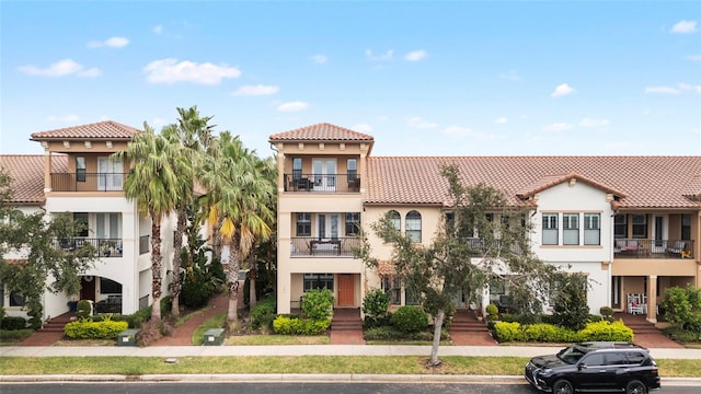 view of front of property with a balcony