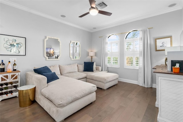 living room featuring ornamental molding, hardwood / wood-style flooring, and ceiling fan