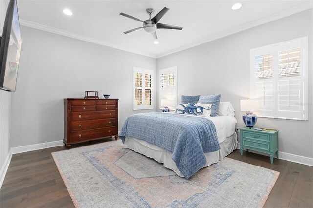 bedroom with multiple windows, dark hardwood / wood-style floors, and ceiling fan