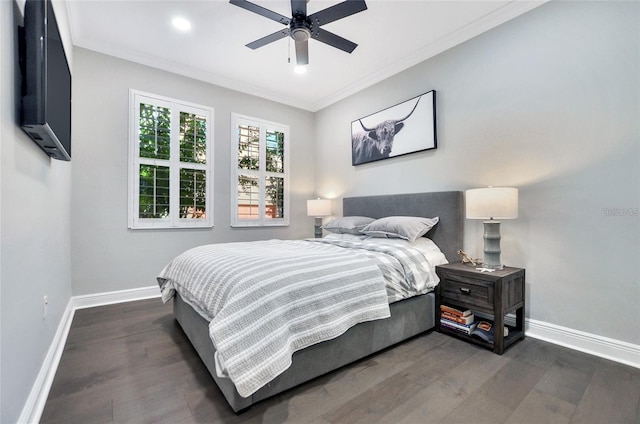 bedroom with ceiling fan, ornamental molding, and dark hardwood / wood-style flooring