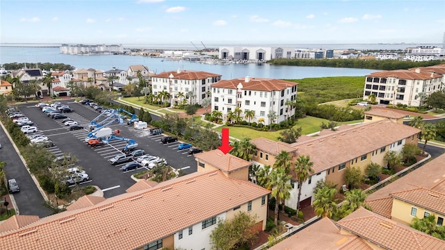 birds eye view of property with a water view